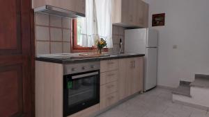 Η κουζίνα ή μικρή κουζίνα στο Alexandra Apartments
