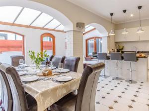 a dining room with a table and chairs at Blair Terrace in Portpatrick