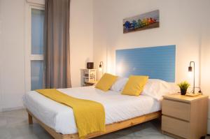 A bed or beds in a room at Novam Studio Centro de Málaga.