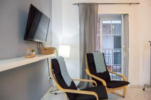 Televízia a/alebo spoločenská miestnosť v ubytovaní Novam Loft Terrace Centro Málaga