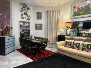 a living room with a couch and a table at Unique CBD home in Bendigo