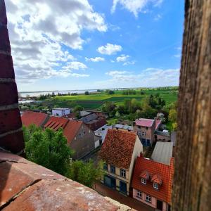 a view of a town from a tower at Gasthaus Natzke in Usedom Town