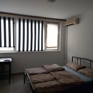 Postel nebo postele na pokoji v ubytování Apartman IGK