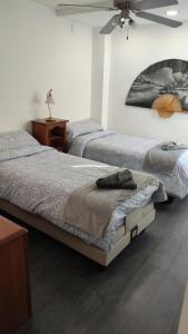 Postel nebo postele na pokoji v ubytování Apartament Melpomeny