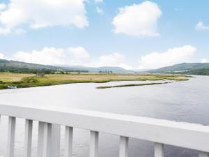 a view of a river from a bridge at Foundry Bank in Bonar Bridge