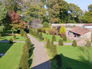 an aerial view of a garden with bushes and a building at Dove Cote House in Westleigh