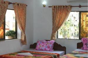 Ένα ή περισσότερα κρεβάτια σε δωμάτιο στο Angkor Ruby Guesthouse