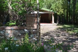a brick wall in front of a building at Rios libres in Potrerillos
