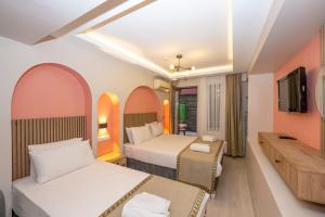 En eller flere senge i et værelse på Valdivia Hotel