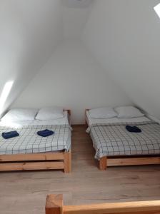 Postel nebo postele na pokoji v ubytování Agroturystyka Ranczo Gościszów