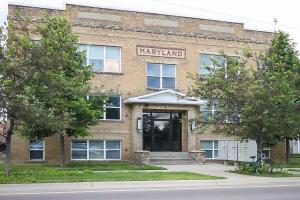 a large brick building with a sign that reads navannah at Updated 2 Bedroom Apartment in Great Falls