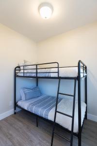 a bedroom with two bunk beds in a room at Updated 2 Bedroom Apartment in Great Falls