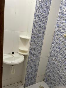 Ванная комната в Navegantes Suítes