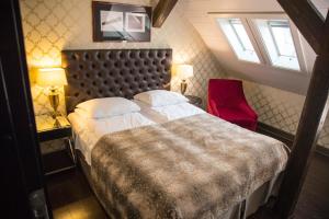 Postel nebo postele na pokoji v ubytování Det Hanseatiske Hotel