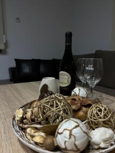 a plate of shells and wine glasses on a table at Guest House Tanevi in Devin +20 photos