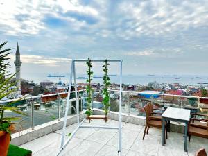 a balcony with a table and a view of a city at Art City Hotel Istanbul in Istanbul