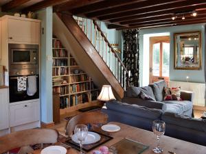 a living room with a couch and a table at Gwernol in Dolwyddelan