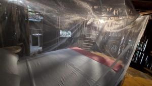 a batting cage with a bed in a room at Auroa Palomino in Palomino