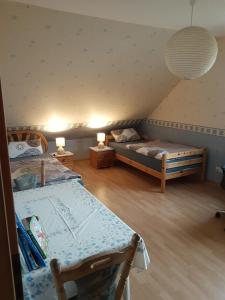 a bedroom with two beds in a attic at FeWo oben in Kalletal