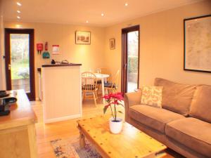 a living room with a couch and a table at The Wooden Lodge in Aymestrey