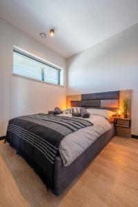 Säng eller sängar i ett rum på Domki i apartamenty Skandynawia