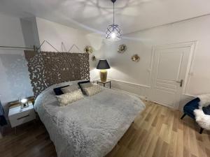 Postel nebo postele na pokoji v ubytování La suite Balnéo