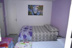 מיטה או מיטות בחדר ב-Hospedagens São Borja RS