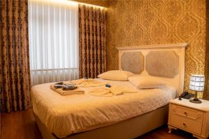 Ліжко або ліжка в номері My Palace Rooms Hotel SAW