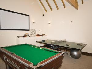 a room with a pool table and a board at The Peacock Barn - E4713 in Dunstall