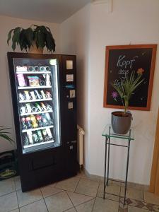 a refrigerator filled with lots of drinks in a room at Ferienappartement Gutshof in Hohenwarth