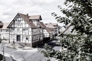 a black and white photo of a large house at Gästehaus Hegerweg 2, Calden in Calden
