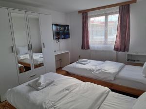 Postel nebo postele na pokoji v ubytování Aleksandar apartmani