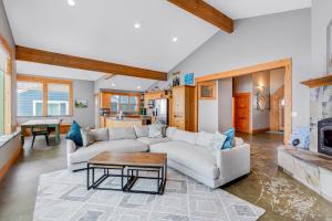 a living room with a couch and a table at Pacific City Ocean Front Escape in Pacific City