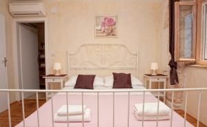 Posteľ alebo postele v izbe v ubytovaní Villa Lauriana + 26 fotografií