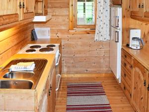 a kitchen with a stove and a sink at 5 person holiday home in olden in Olden +12 photos