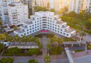 an overhead view of a white building in a city at Akra V - Access to Akra Antalya in Antalya