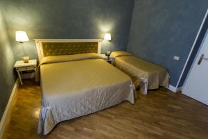 Letto o letti in una camera di Hotel Gennarino