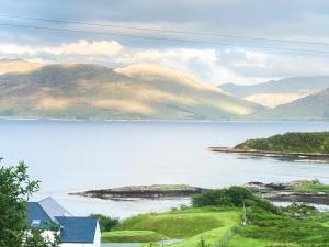 a view of a body of water with mountains in the background at The Croft in Isleornsay