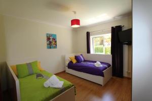 Postel nebo postele na pokoji v ubytování Villa Maelou Vilamoura Algarve + 18 fotografií