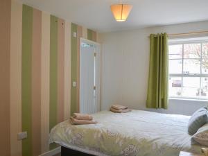 Säng eller sängar i ett rum på Blaithwaite Stables