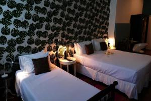 Katil atau katil-katil dalam bilik di Aram Yamí Boutique Hotel