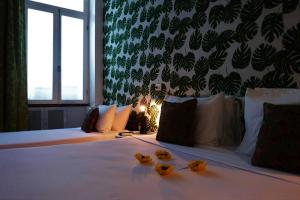 Katil atau katil-katil dalam bilik di Aram Yamí Boutique Hotel