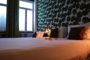 Katil atau katil-katil dalam bilik di Aram Yamí Boutique Hotel