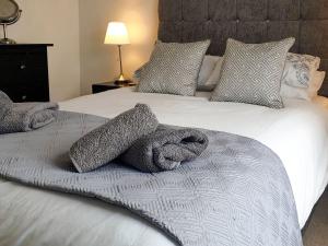 Cama o camas de una habitación en Kingfisher Cottage