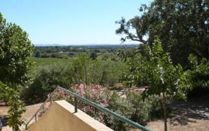 a staircase with a view of a field and trees at Domaine des fouques in Hyères +6 photos