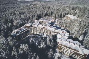 an aerial view of a resort with snow covered trees at BoroHome in Borovets