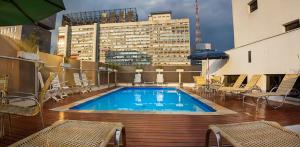 a swimming pool on the roof of a building at Apto com WiFi piscina e proximo ao MASP Sao Paulo in São Paulo