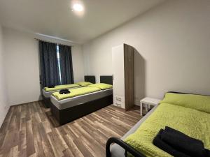 Ein Bett oder Betten in einem Zimmer der Unterkunft CITY-APARTMENTS in KREMS an der Donau