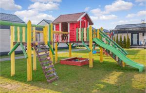 a group of playground equipment in a yard at Stunning Apartment In Jezierzany With Kitchen in Jezierzany