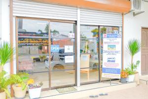 a store window with a sign in front of it at Citra Kadok Hotel & Banquet Hall in Kota Bharu